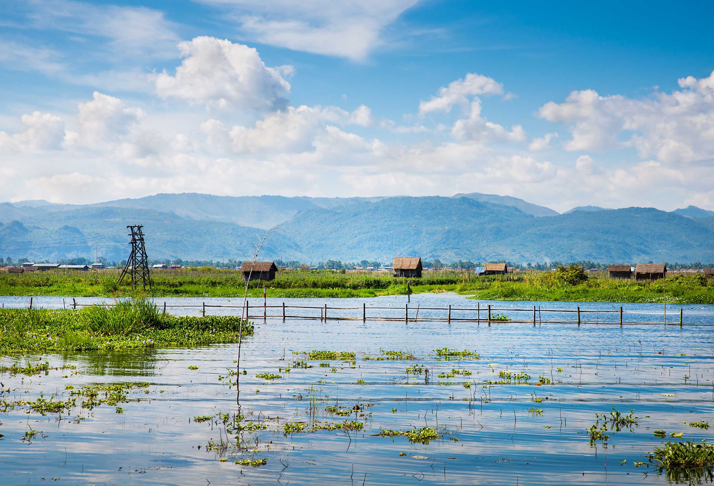 Ancient Houses And Their Reflection In The Water On The Inle Lake Myanmar