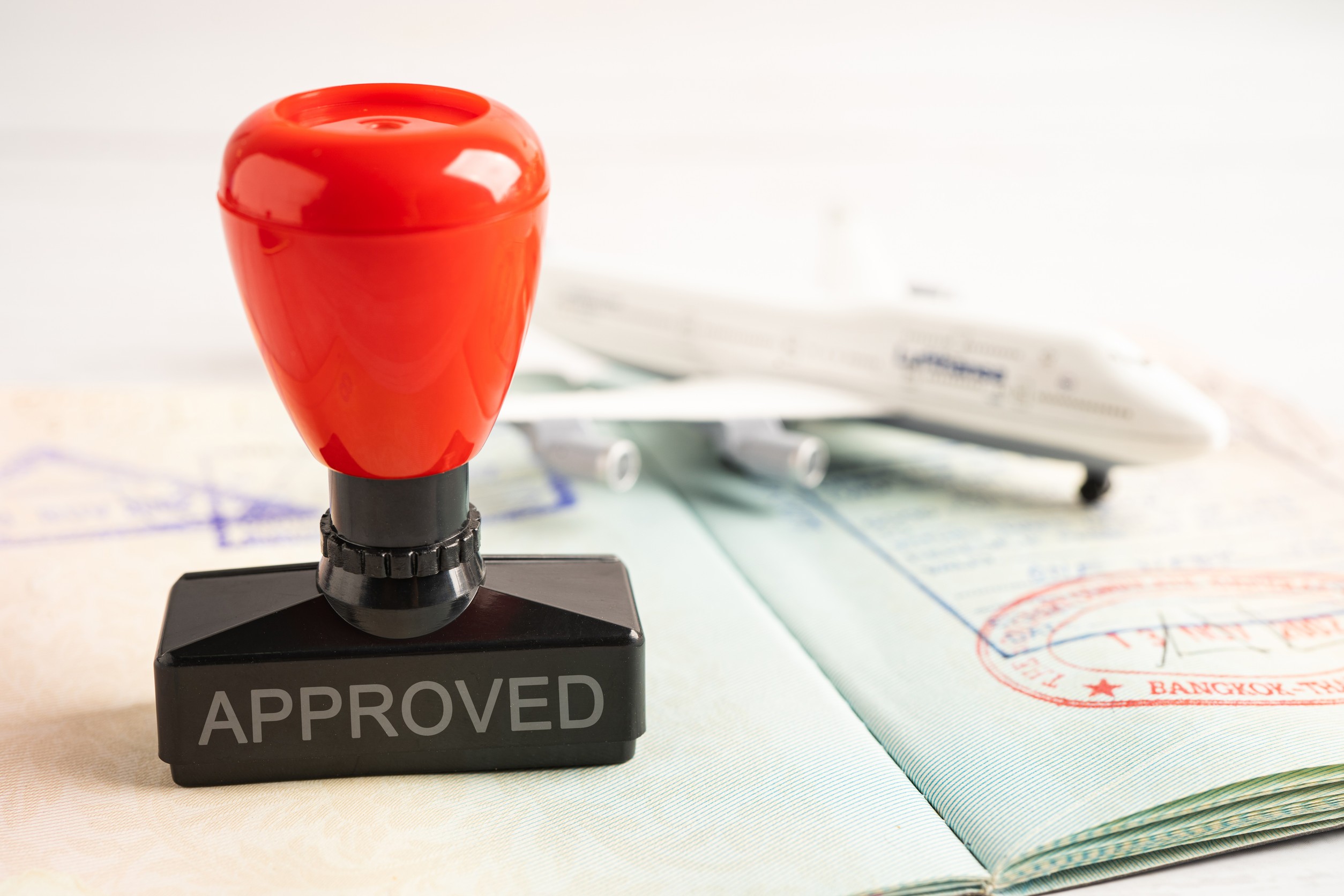 Approved Stamp Visa And Passport Document To Immigration At Airport In Country