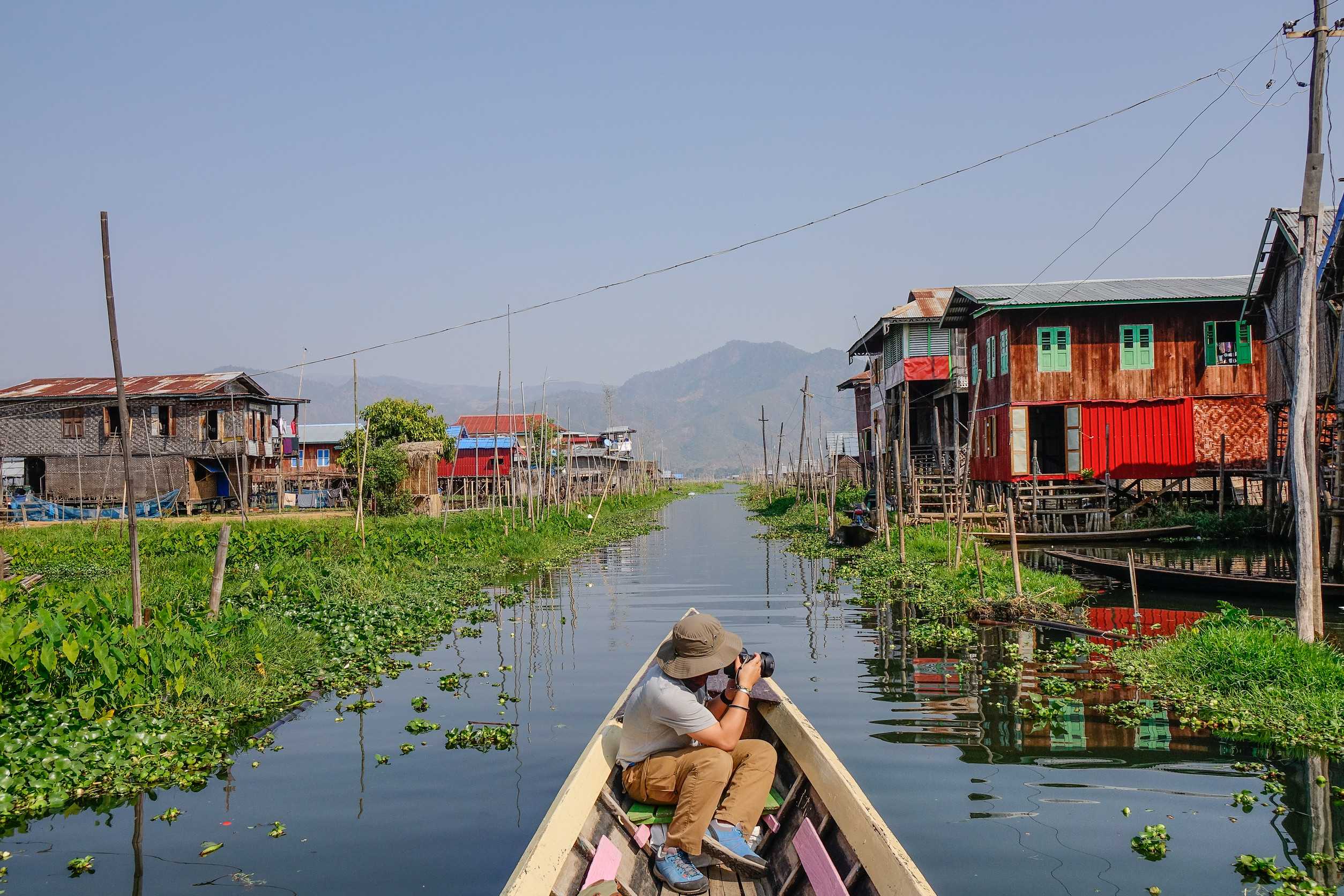 Boat ride through Inle Lake village, Shan State, Myanmar