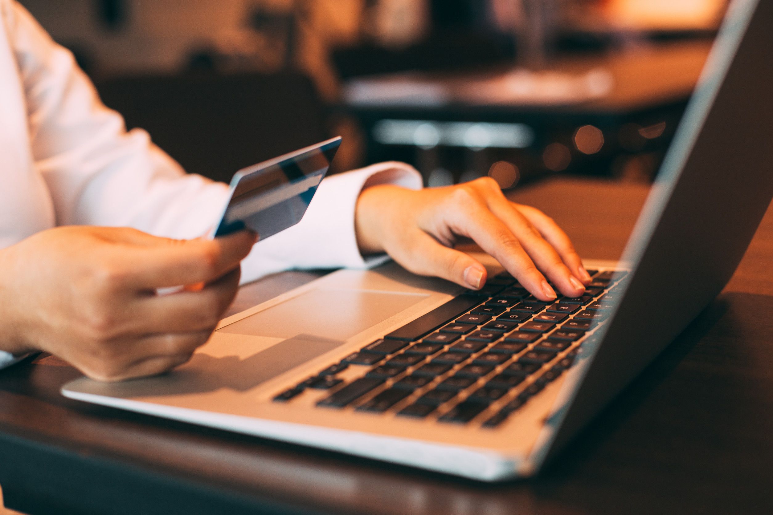 Businesswoman Holding Credit Card And Using Laptop
