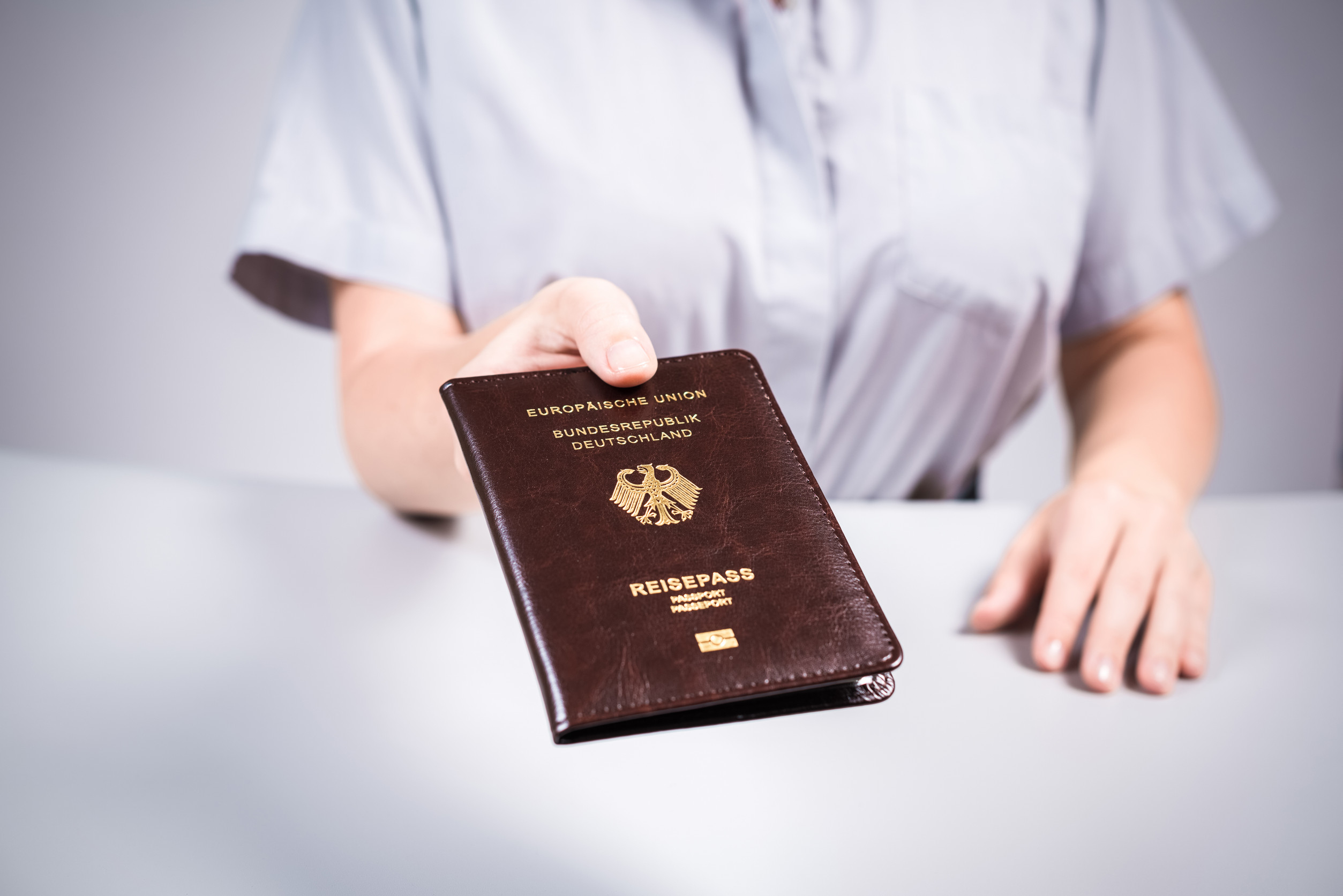 Immigration and passport control at the airport woman border control officer with deutsch