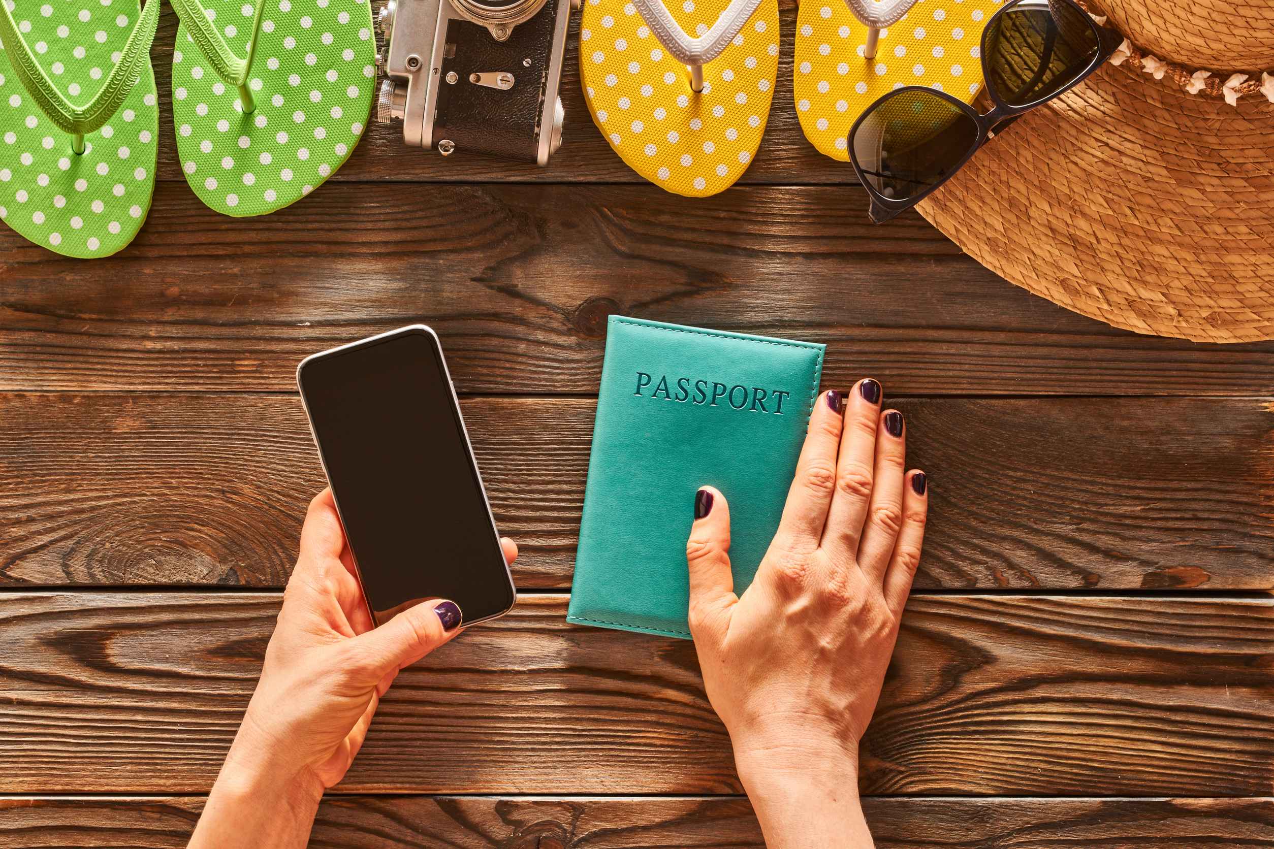 Planning A Beach Trip Woman Holding Smartphone Travel Items For Beach Tourism Still Life Over