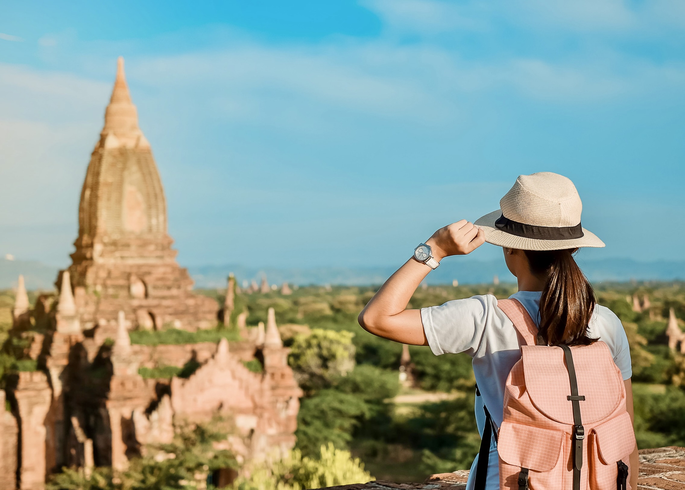 Tourist admiring an ancient temple in Bagan, Myanmar