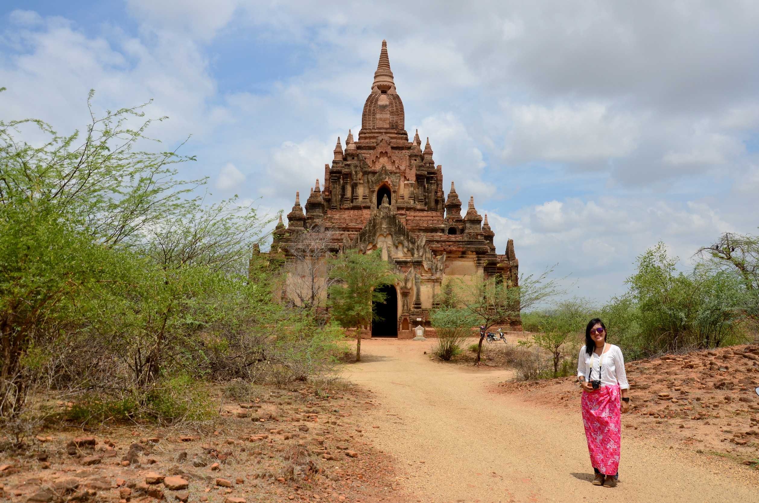 Woman staning at myauk guni temple in bagan archaeological zone at bagan myanmar