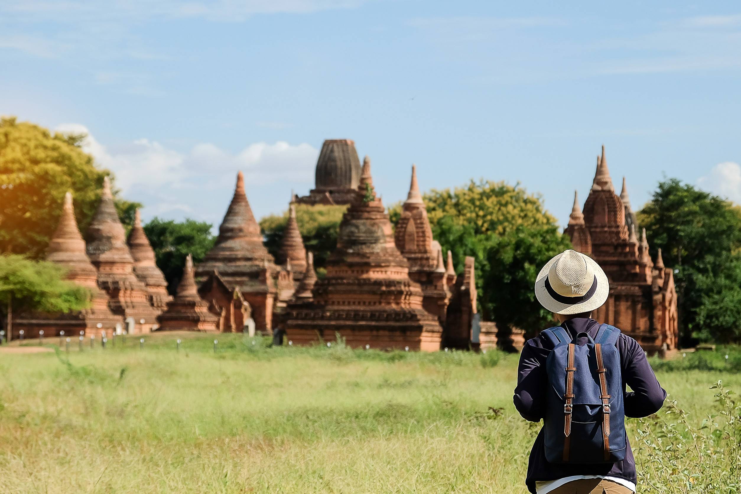 Young Man Traveling Backpacker With Hat Asian Traveler Looking Beautiful Ancient Temples And Pagoda