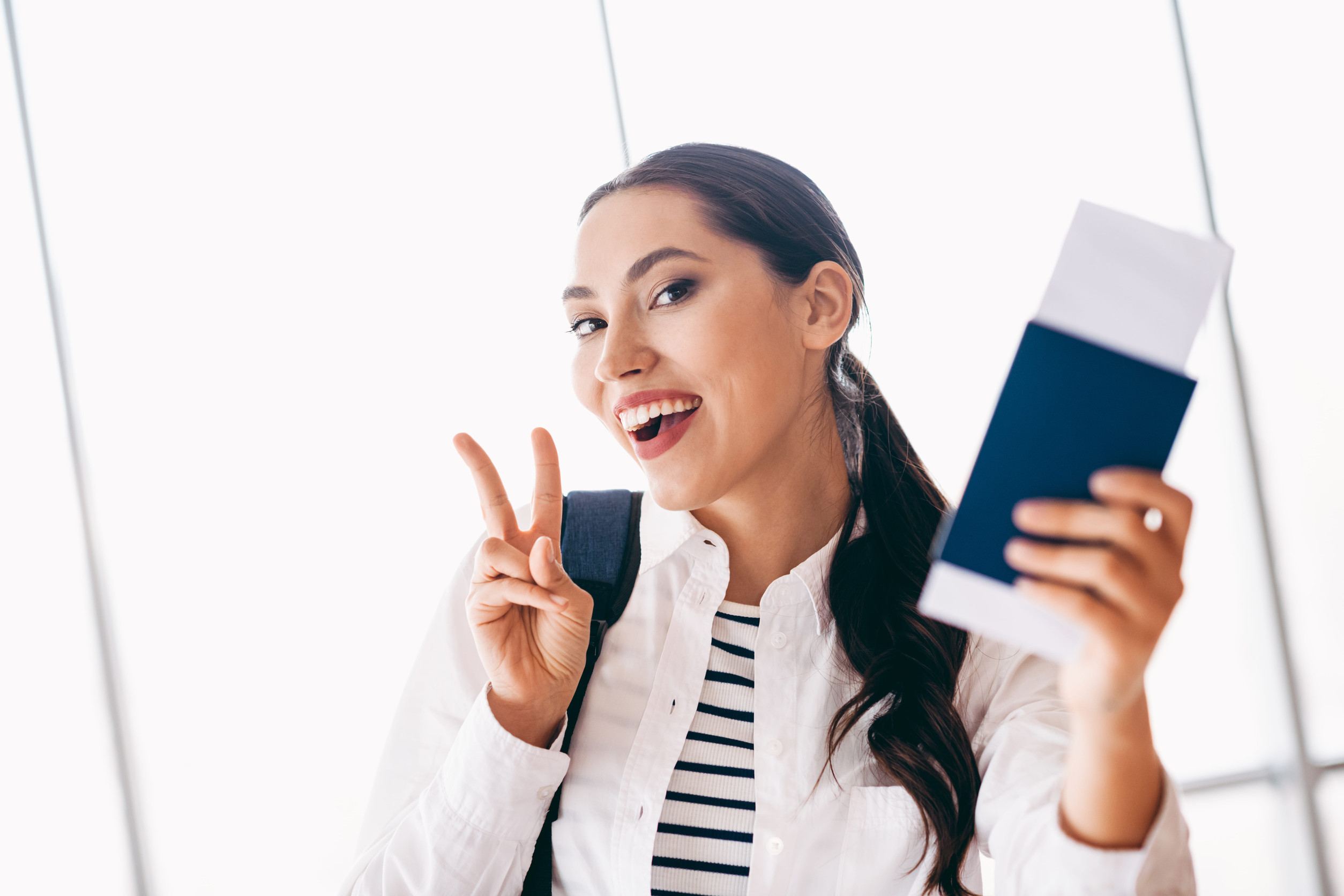 Young Woman Traveler Holding Her Passport